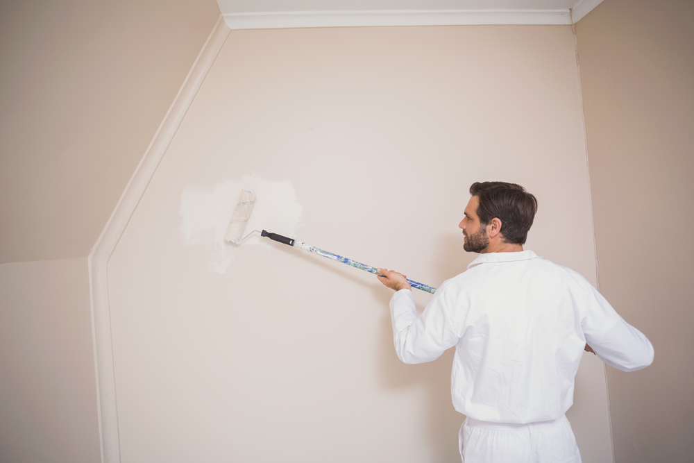 A House Painter In Hanover PA Painting a wall in a house